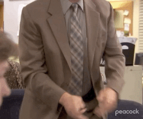 GIF of Dwight from the tv series 'The Office' breaking his office furniture